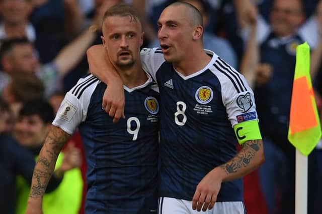 Scott Brown celebrates wtih Leigh Griffiths after the striker's glorious free-kick double against England in June 2017. Picture: Paul Ellis/AFP via Getty Images