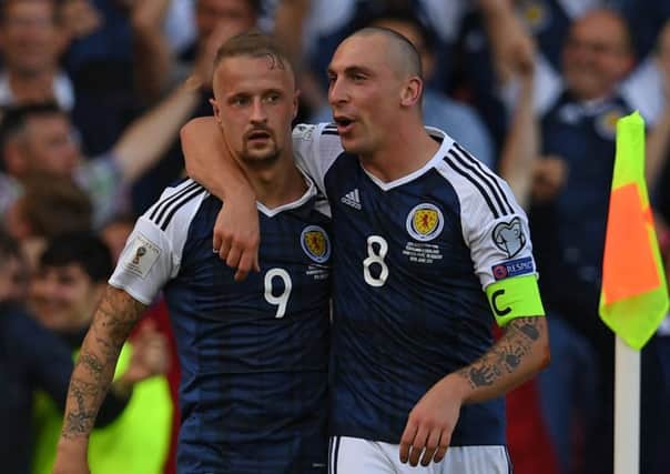 Scott Brown celebrates wtih Leigh Griffiths after the striker's glorious free-kick double against England in June 2017. Picture: Paul Ellis/AFP via Getty Images