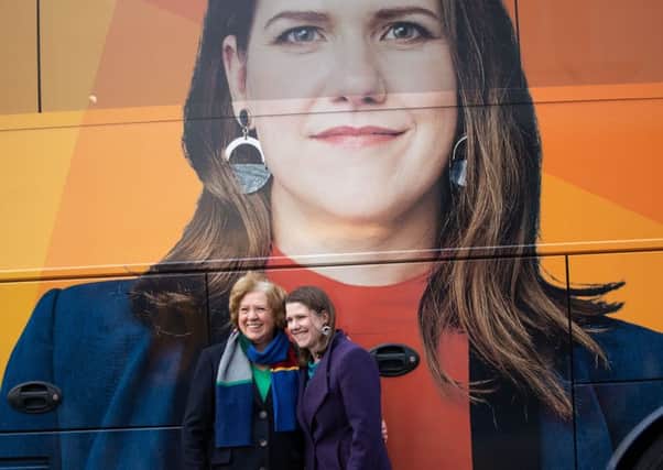 Liberal Democrat leader Jo Swinson poses with her mother Annette in front of the party's tour bus while on the campaign trail in Glasgow. Picture: Aaron Chown/PA Wire