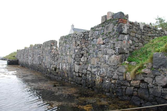 Remains of MacNeil's kelp processing plant at Northbay, Barra, with the kelp delivered by boat to the boundary wall. PIC: Ben Buxton.