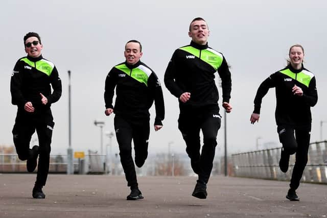 Ajay Green, William Gray, James Palmer and Dion Polland, apprentices of The Coach Core, run at the Emirates Arena. Picture: John Devlin