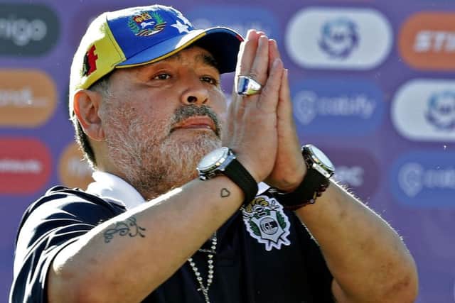 (FILES) In this file photo taken on November 02, 2019, Gimnasia y Esgrima team coach Diego Armando Maradona gestures to supporters as he leaves the field after an Argentina First Division Superliga football match against Estudiantes, at El Bosque stadium, in La Plata, Buenos Aires province, Argentina. - Diego Maradona resigned on November 19, 2019, as coach of Argentina's first-division club Gimnasia y Esgrima La Plata, the president of the club, Gabriel Pellegrino, said. (Photo by ALEJANDRO PAGNI / AFP) (Photo by ALEJANDRO PAGNI/AFP via Getty Images)