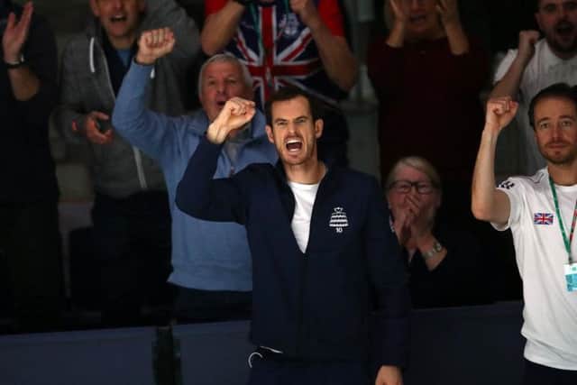 Andy Murray cheers on his British team-mates during the Davis Cup. Picture: Getty