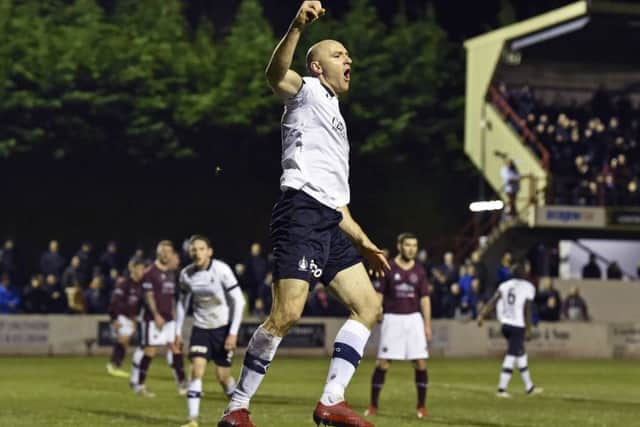 Conor Sammon celebrates scoring against Falkirk at Prestonfield. Picture: Rob Casey/SNS