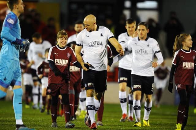 The teams take to the field for Linlithgow Rose v Falkirk in the Scottish Cup third round. Picture: Michael Gillen