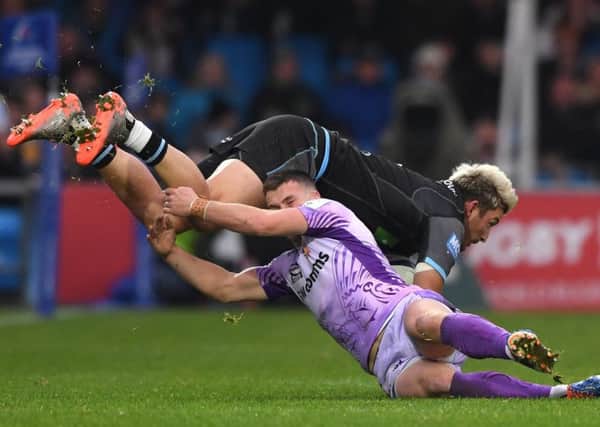 Glasgow winger DTH van der Merwe is tackled by Exeter's Joe Simmonds. Picture: Stu Forster/Getty Images