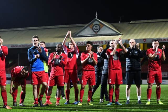 The Penicuik squad applaud the fans at full time. Picture: Gary Hutchison / SNS