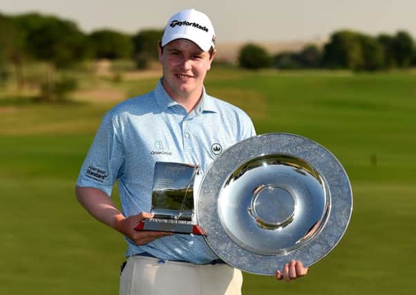 Bob MacIntyre shows off the Sir Henry Cotton Rookie of Year and Challenge Tour Graduate of the Year Trophy in Dubai. Picture: Getty Images