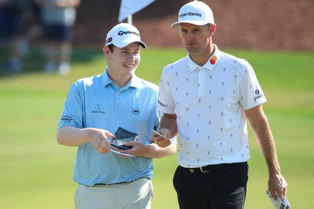 Bob MacIntyre has a laugh with his playing partner, Olympic champion Justin Rose, on the Earth Course at Jumeirah Golf Estates. Picture: Getty Images