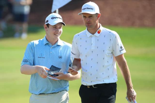 Bob MacIntyre and Justin Rose chat during the final round of the DP World Tour Championship Dubai at Jumerirah Golf Estates. Picture: Andrew Redington/Getty Images