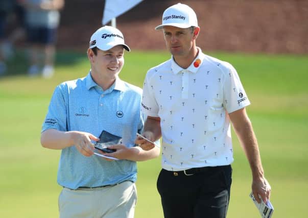Bob MacIntyre and Justin Rose chat during the final round of the DP World Tour Championship Dubai at Jumerirah Golf Estates. Picture: Andrew Redington/Getty Images