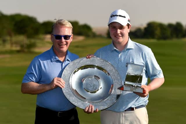 European Tour CEO Keith Pelley presents Bob MacIntyre with the Sir Henry Cotton Rookie of Year Award and Challenge Tour Graduate of tyhe Year trophies in Dubai. Picture: Getty Images