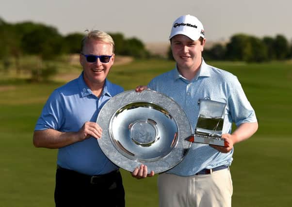 European Tour CEO Keith Pelley presents Bob MacIntyre with the Sir Henry Cotton Rookie of Year Award and Challenge Tour Graduate of tyhe Year trophies in Dubai. Picture: Getty Images