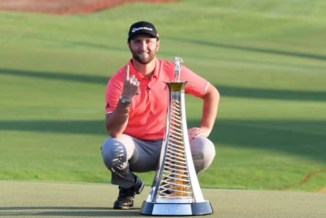 Jon Rahm poses with the Race to Dubai trophy following his victory at the DP World Tour Championship Dubai at Jumerirah Golf Estates. Picture: Ross Kinnaird/Getty Images