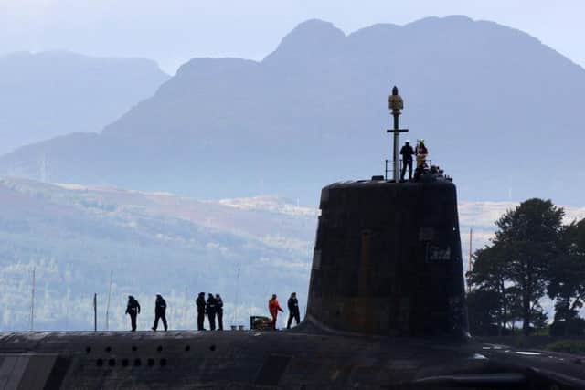 A trident submarine makes it's way out from Faslane Naval base. Picture: Getty
