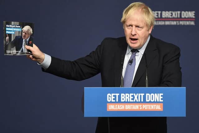 Mr Johnson unveiled a party manifesto in a venue decked out with the message My Guarantee". Picture: PA