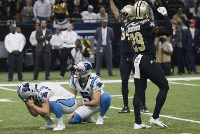 Carolina Panthers kicker Joey Slye, left, reacts after missing a field goal late in the fourth quarter against the New Orleans Saints. Picture: Butch Dill/AP