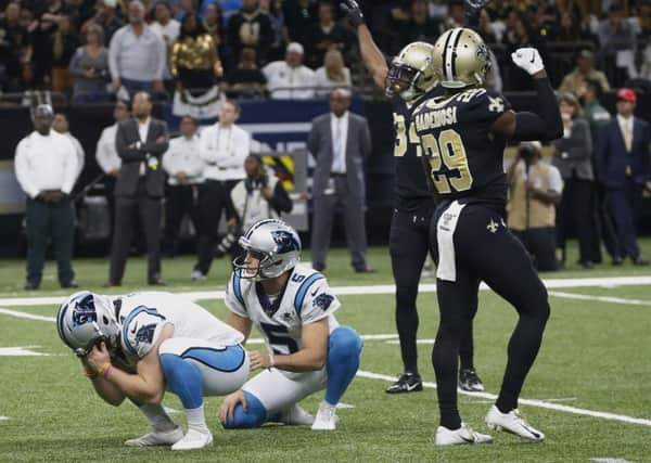 Carolina Panthers kicker Joey Slye, left, reacts after missing a field goal late in the fourth quarter against the New Orleans Saints. Picture: Butch Dill/AP