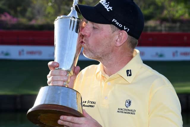 Stephen Gallacher kisses the trophy after he won the Hero Indian Open Picture: Ross Kinnaird/Getty
