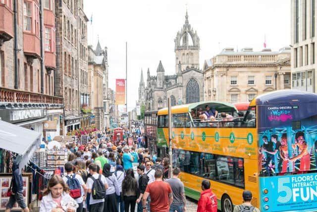 Tourists flock to Edinburgh's Royal Mile at the height of the tourist season