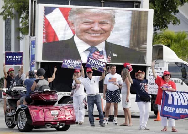 Supporters wait to see Donald Trumps motorcade at Mar-a-Largo in West Palm Beach (Picture: Luis M. Alvarez/AP)