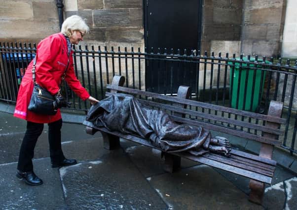 A sculpture of a homeless Jesus sleeping rough in Glasgow city centre (Picture: John Devlin)