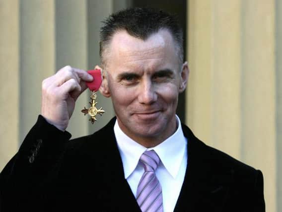 Gary shows off his Order of the British Empire (OBE) awarded for services to the hospitality industry in 2006.