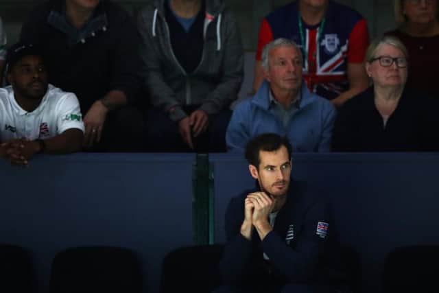 Andy Murray looks on during the Davis Cup tournament in Madrid. The Scot is hopeful of playing at Wimbledon next year