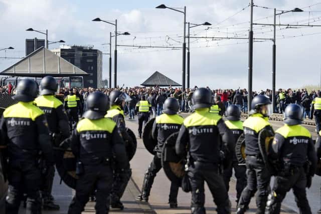Dutch police in riot gear gather outside De Kuip stadium (File image)