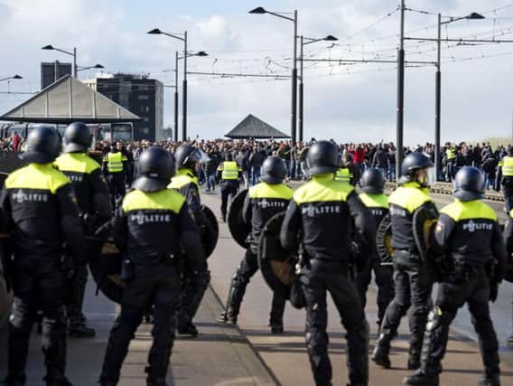 Dutch police in riot gear gather outside De Kuip stadium (File image)