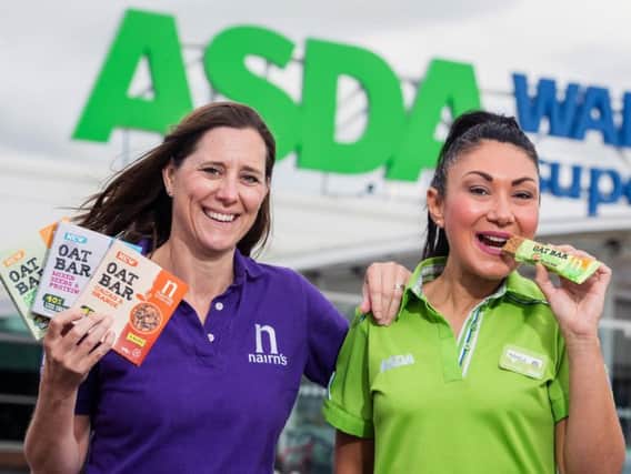 Nairn's account controller Amy Morrison and Asda customer service assistant Manila Margiotta celebrate Nairn's Oat Bar listing. Picture: Ian Georgeson