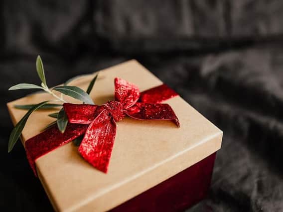 The mysterious Santa-like figure adds notes to each present, usually tagging thema "random actof kindness", before signing "fromKegworths Secret Santa".