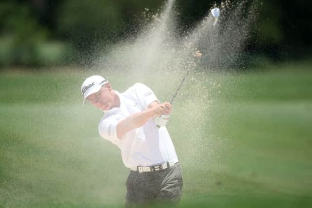 Grant Forrest plays his second shot from a bunker on the third hole at Leopard Creek. Picture: Jan Kruger/Getty