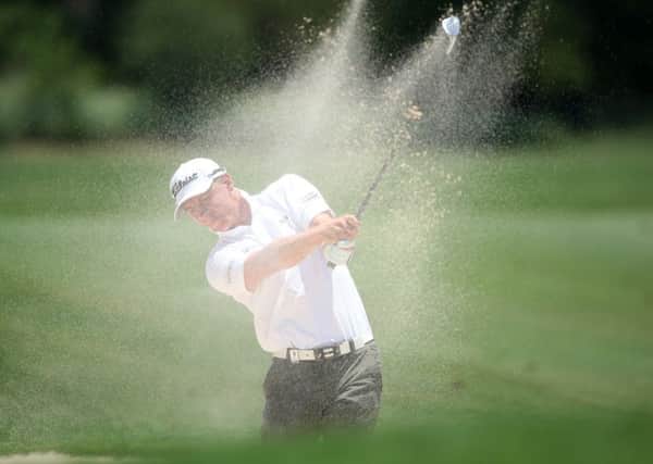 Grant Forrest plays his second shot from a bunker on the third hole at Leopard Creek. Picture: Jan Kruger/Getty