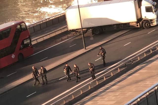 Armed police on the scene at London Bridge where there have been reports of gunfire. Picture: SWNS/ Alexandra Carr