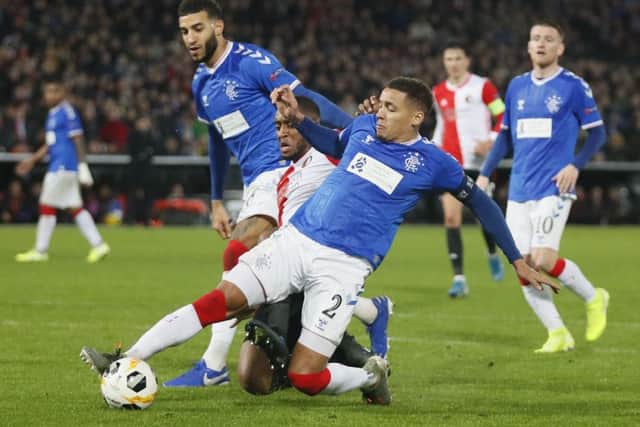 Rangers' James Tavernier clears the ball from Feyenoord's Leroy Fer during the 2-2 draw in Rotterdam. Picture: Peter Dejong/AP