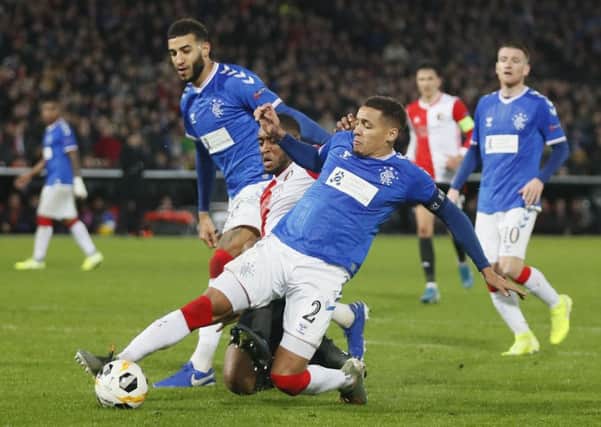 Rangers' James Tavernier clears the ball from Feyenoord's Leroy Fer during the 2-2 draw in Rotterdam. Picture: Peter Dejong/AP