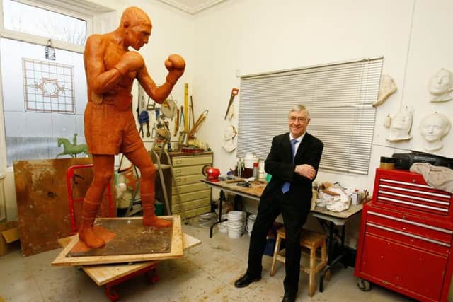 Ken Buchanan gets the first glimpse of his statue created by renowned Scottish sculptor Alan Herriot thanks to the efforts of the Ken Buchanan Foundation. It will be displayed in Leith. Picture: Paul Reid