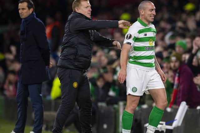 Celtic manager Neil Lennon shares a joke with Scott Brown after he substitutes him against Rennes. Picture: Craig Williamson / SNS