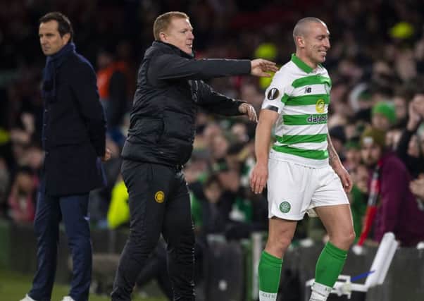 Celtic manager Neil Lennon shares a joke with Scott Brown after he substitutes him against Rennes. Picture: Craig Williamson / SNS