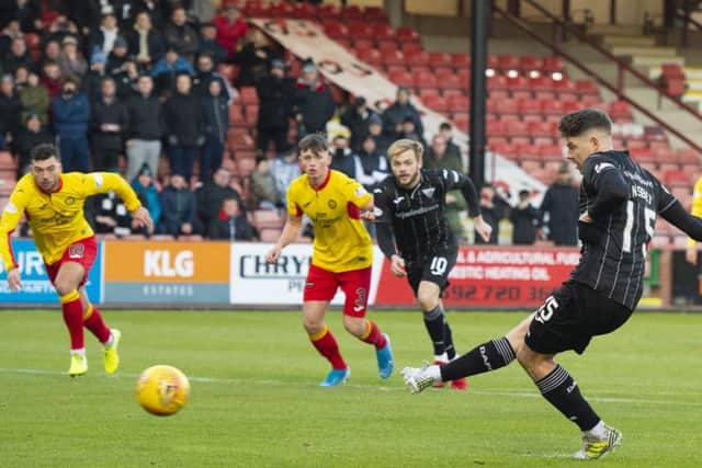 Dunfermline's Kevin Nisbet opens the scoring with a penalty against Partick Thistle. He would go on to score four. Picture: Euan Cherry / SNS