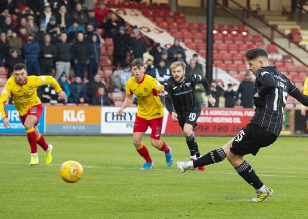 Dunfermline's Kevin Nisbet opens the scoring with a penalty against Partick Thistle. He would go on to score four. Picture: Euan Cherry / SNS