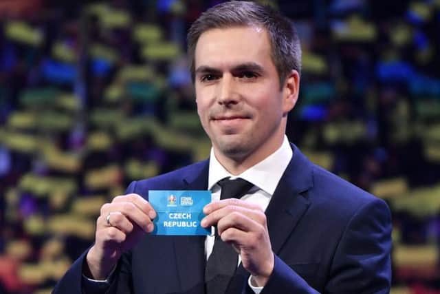 Former Germany player Philipp Lahm holds up a slip of paper after drawing Czech Republic into Group D at Euro 2020 where they will face England, Croatia and potentially Scotland. Picture: AFP/Getty Images