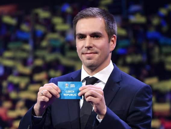 Former Germany player Philipp Lahm holds up a slip of paper after drawing Czech Republic into Group D at Euro 2020 where they will face England, Croatia and potentially Scotland. Picture: AFP/Getty Images