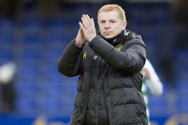 Celtic manager Neil Lennon applauds the Celtic fans after his side's 4-1 win at Ross County. Picture: Ian Rutherford/PA