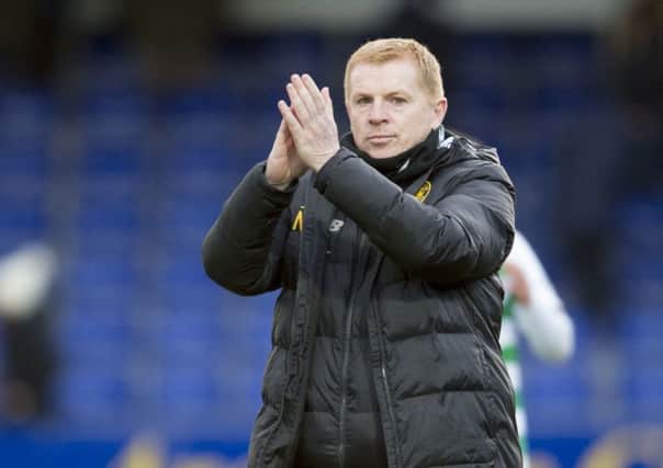 Celtic manager Neil Lennon applauds the Celtic fans after his side's 4-1 win at Ross County. Picture: Ian Rutherford/PA
