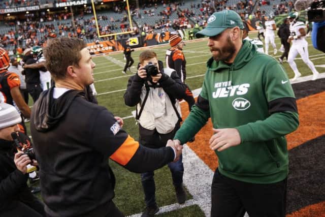 Cincinnati Bengals head coach Zac Taylor, left, and New York Jets head coach Adam Gase, right, shake hands. Picture: Frank Victores/AP