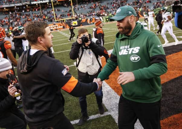 Cincinnati Bengals head coach Zac Taylor, left, and New York Jets head coach Adam Gase, right, shake hands. Picture: Frank Victores/AP