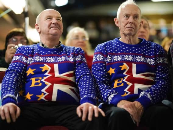 Brexit party supporters Barry Clarkson (R) and Alastair Sutcliffe proudly wearing their Brexit Christmas jumpers