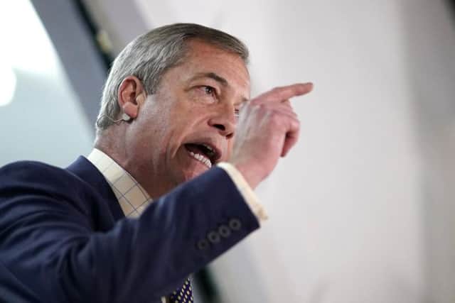 Brexit party leader Nigel Farage addresses his supporters at a Brexit party campaign event in Buckley